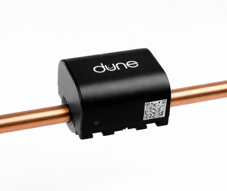 Dune clamp-on ultrasonic water submeter installed on a copper pipe
